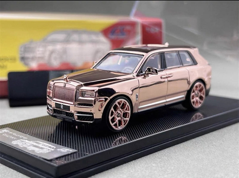 Rose gold diecast model SUV toy car on display base, front three-quarter view
