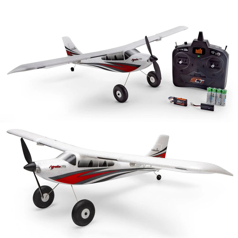 White and red RC airplane with tricycle landing gear, propeller, and black remote controller