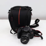 Canon EOS DSLR camera with attached zoom lens and black carrying bag