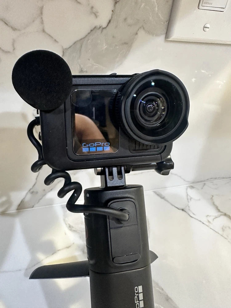 Black GoPro HERO13 Creator action camera with front lens and foam mic