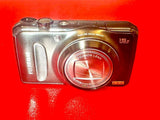 Silver Fujifilm compact digital camera with Fujinon zoom lens and EXR mark