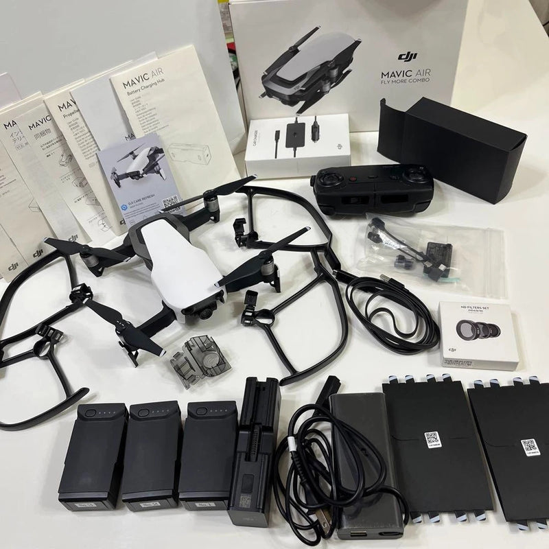 Folding drone kit with controller, extra batteries, charging dock, and cables