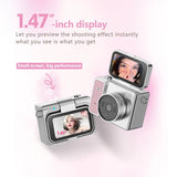 Thumb keychain mini camera with silver body and dual LCD screens, front and back