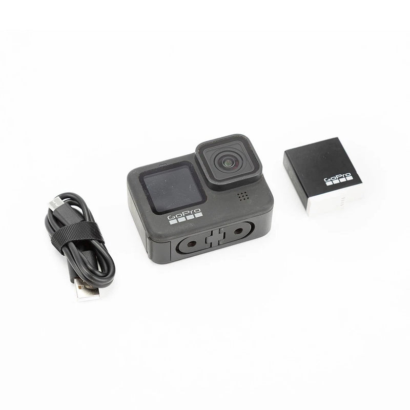 GoPro HERO9 Black action camera with USB cable and power adapter, front view
