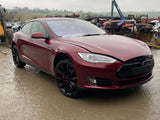 Red Tesla Model S front view with black alloy wheels