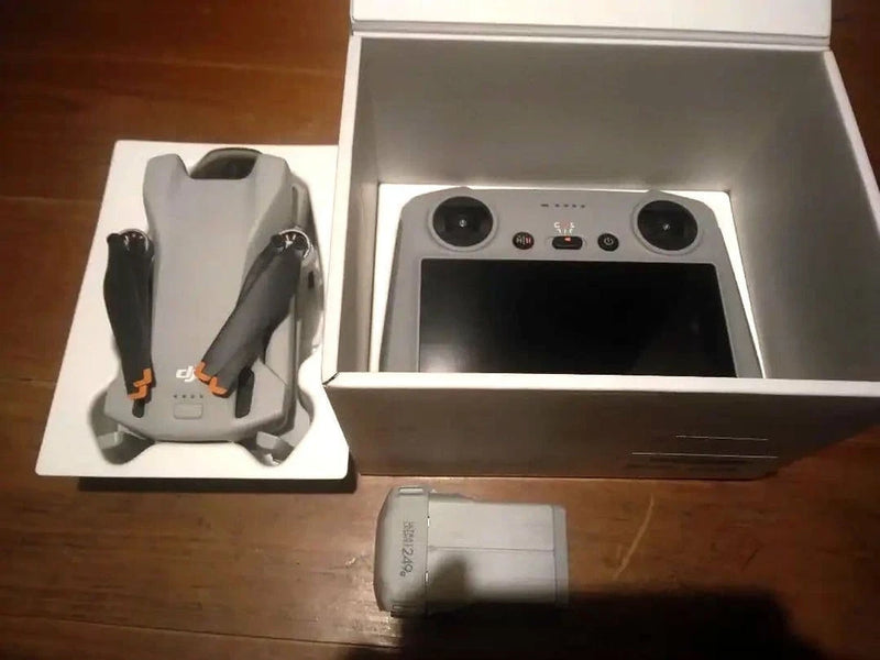 DJI Mini 3 drone and smart controller set in open box