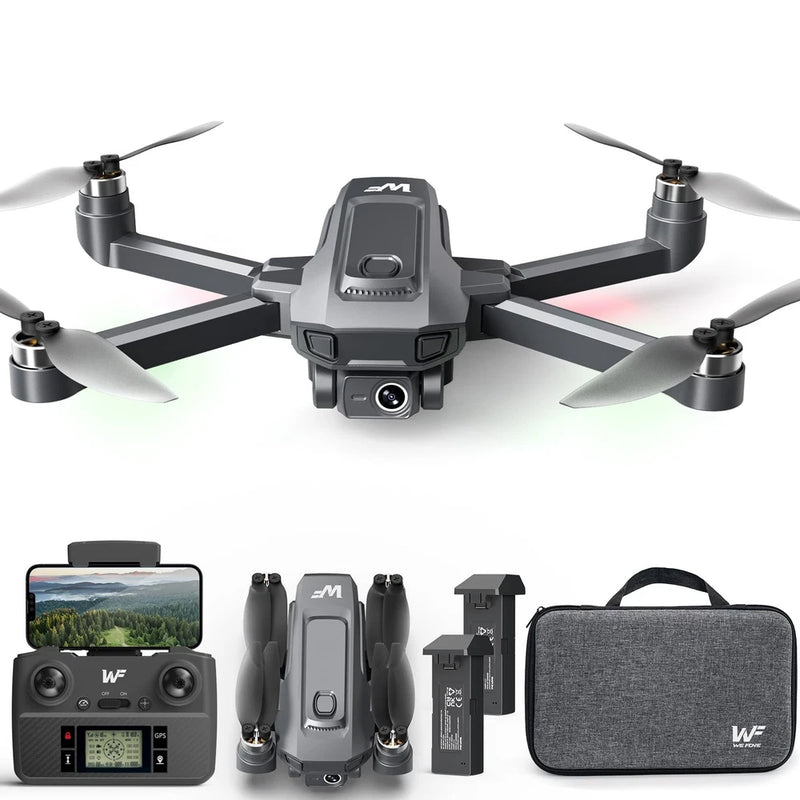 Quadcopter drone with propellers, remote controller, batteries, and carrying case