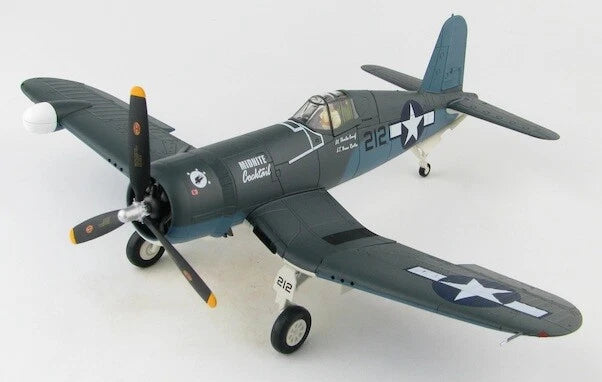 Dark green F4U-2 Corsair model airplane with USMC star markings and landing gear