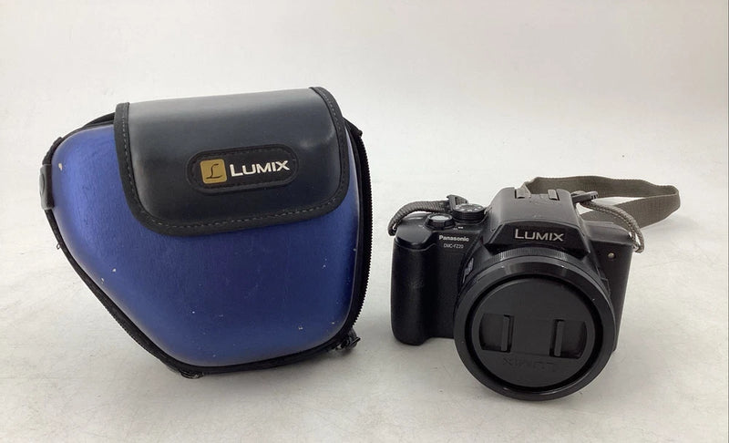 Panasonic Lumix digital camera with black body and blue carrying case, lens front visible