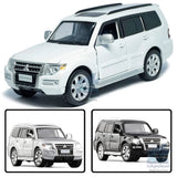 White Mitsubishi Pajero V97 diecast SUV model car, front 3/4 view with wheels