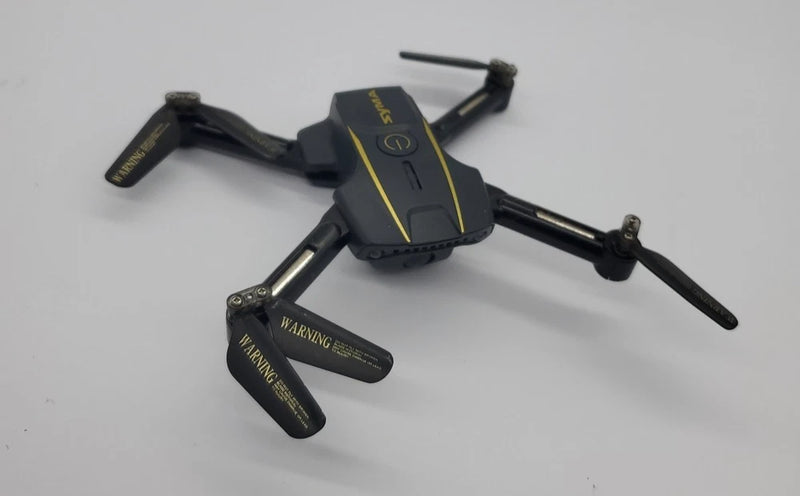 Syma X200 mini quadcopter drone with foldable arms and four rotors, black