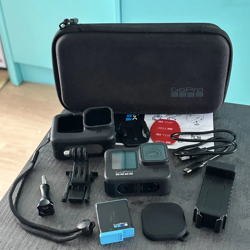 Action camera accessories bundle with black zip case, mounts, batteries, and screens
