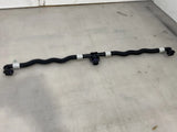 Battery cooling pipe adaptor with black ribbed tube and electrical connectors