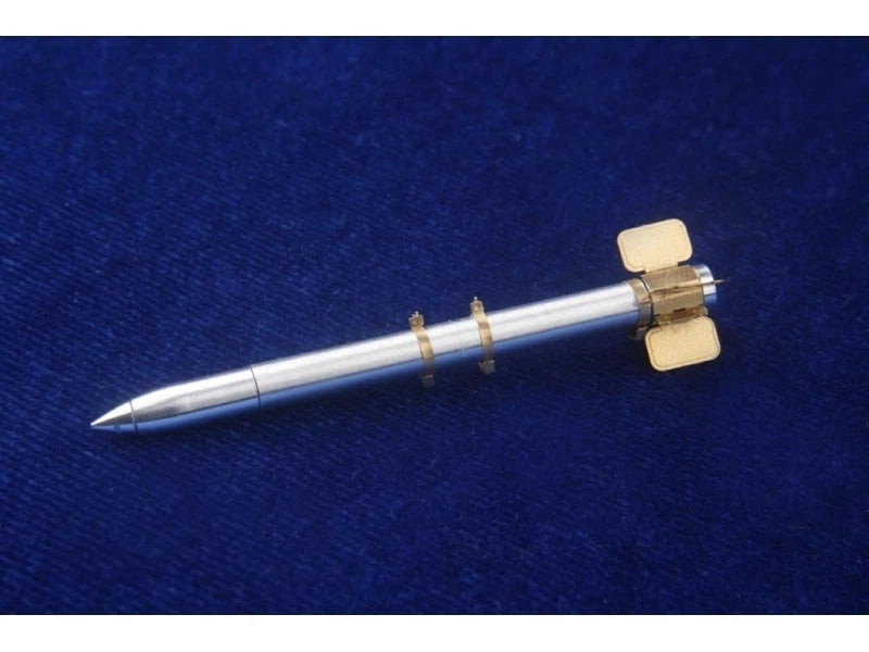 1/32 scale silver rocket model with pointed nose and fins, detail parts included