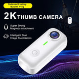White mini action camera with magnetic thumb mount and front lens