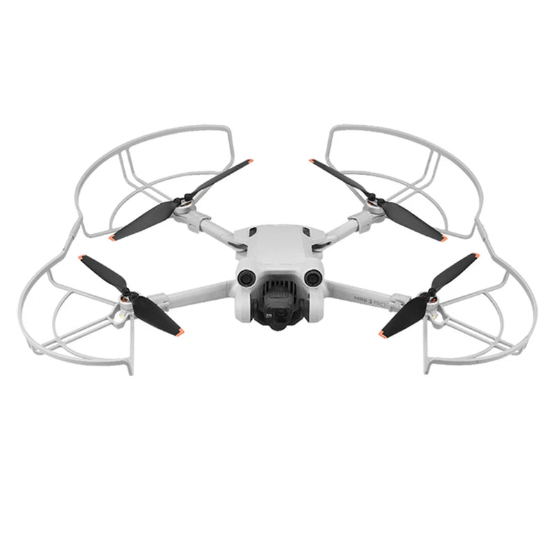 White drone with propeller guards and four black propellers