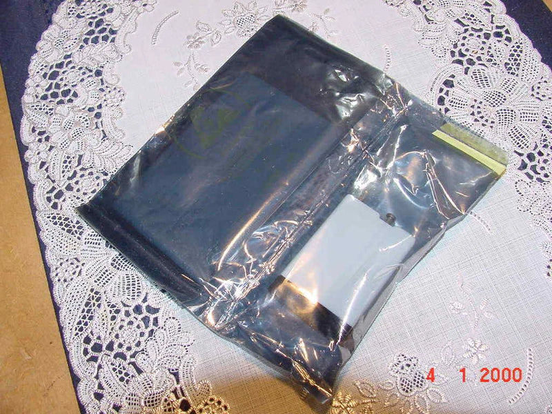 Black isolated analog voltage input module in clear plastic bag, with connector.