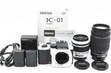 White Pentax K-01 SLR camera lens kit with 18-55mm and 55-300mm lenses