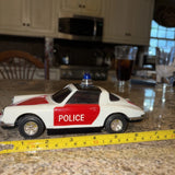 Rare Trico battery operated model car radio, Police Porsche Battery