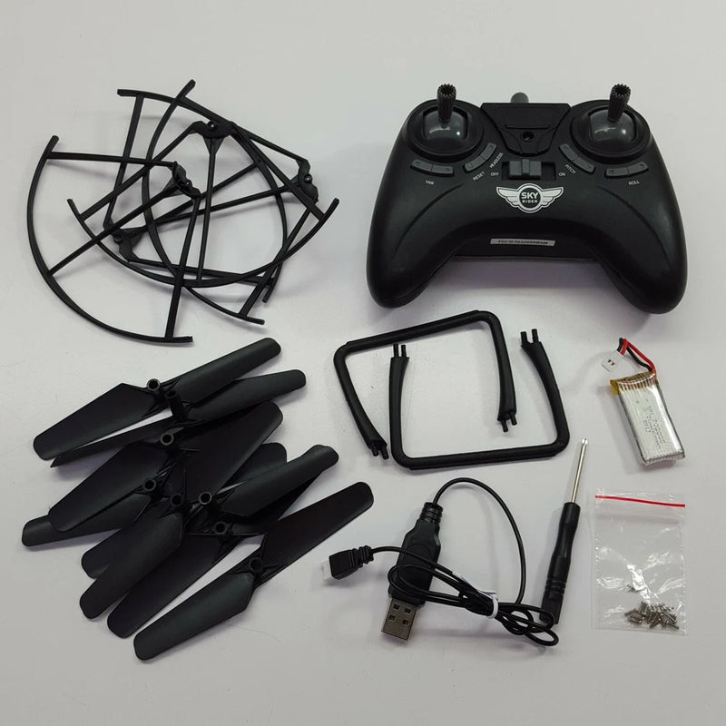 Drone replacement parts kit with controller, propellers, frame, battery, and USB cable