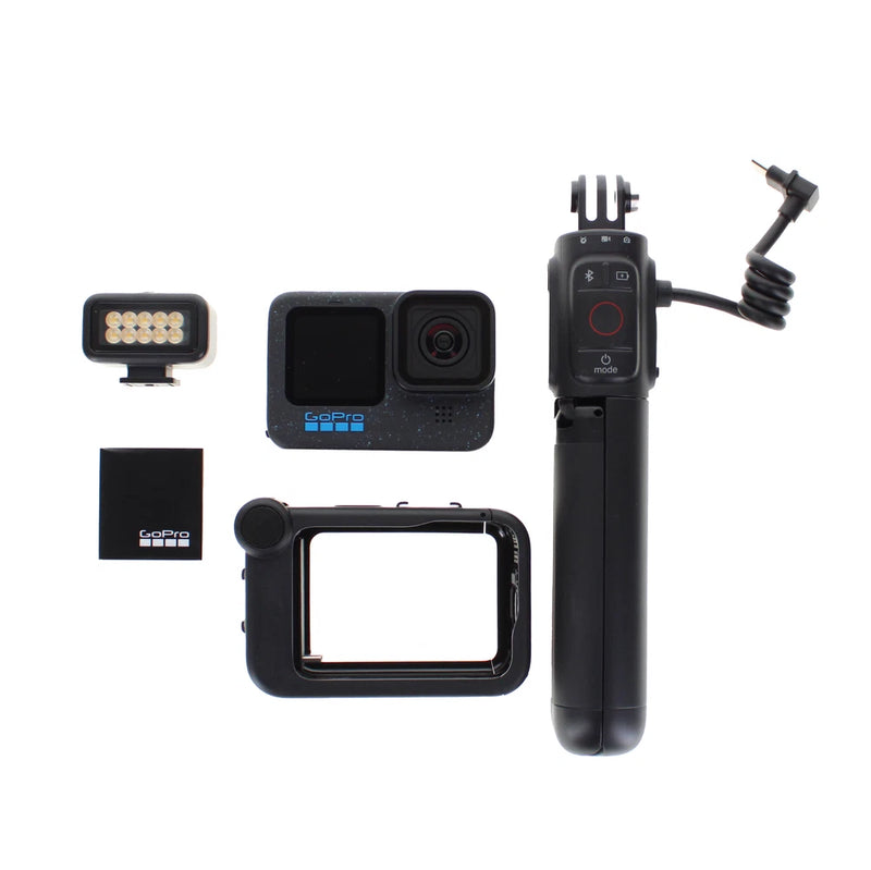Black GoPro HERO12 action camera with side grip, remote mount, and LED light accessory