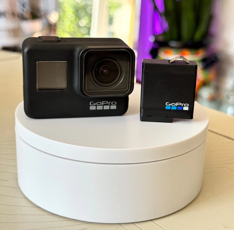 Black GoPro HERO7 action camera with battery accessory