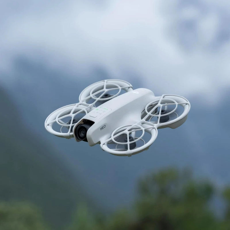 White quadcopter mini drone with front camera and protective prop guards