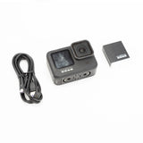 GoPro HERO9 Black action camera with connecting cable and mounting parts