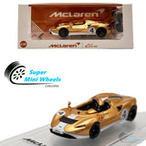 CM-Model 1:64 Mclaren Elva (Metallic Gold) with Extra Wheels