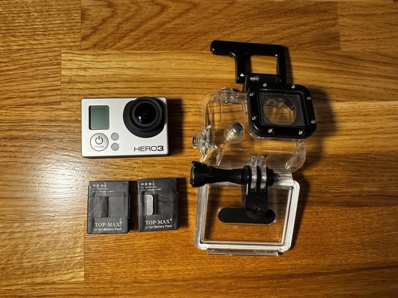 GoPro HERO3 action camera kit with waterproof housing, mounting bracket, and 3 batteries