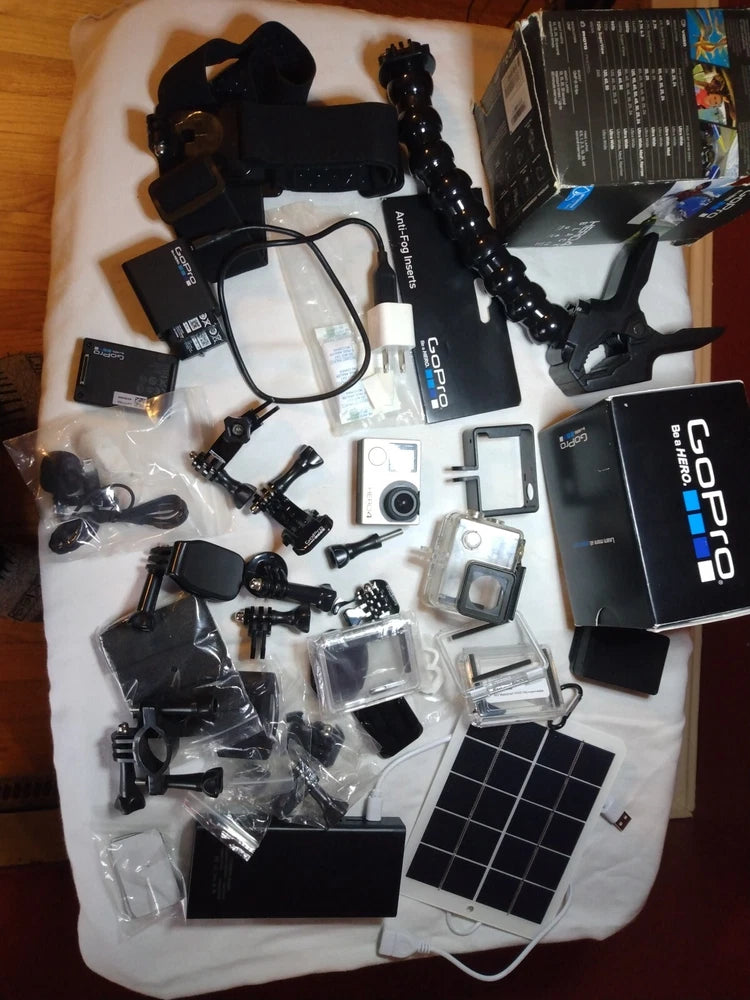 GoPro HERO4 action camera bundle with multiple mounts, housings, batteries and accessories
