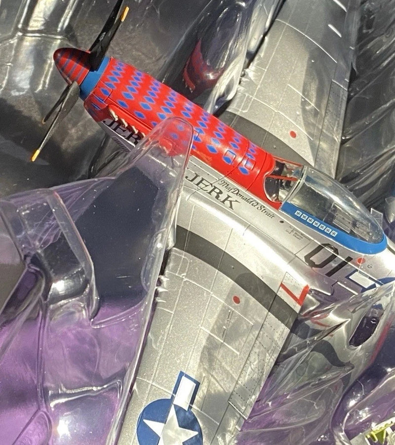 Die-cast P-51D airplane model with colorful red and blue markings in clear blister packaging