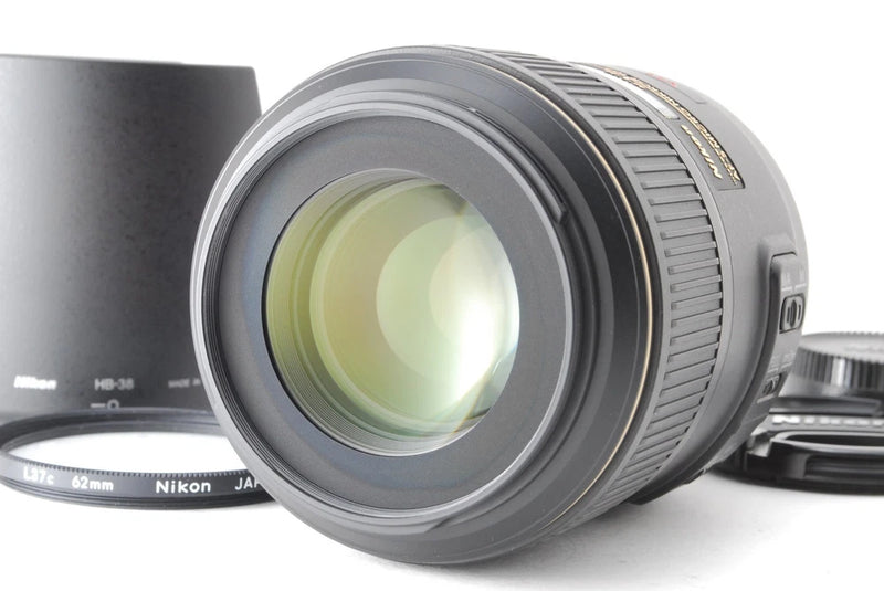 Nikon AF-S Micro NIKKOR 105mm lens with front glass and ribbed focus ring, gray body