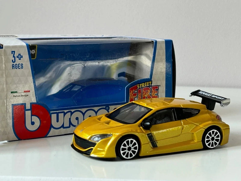 Metallic yellow Bburago Renault Megane Sport die-cast model car with rear spoiler