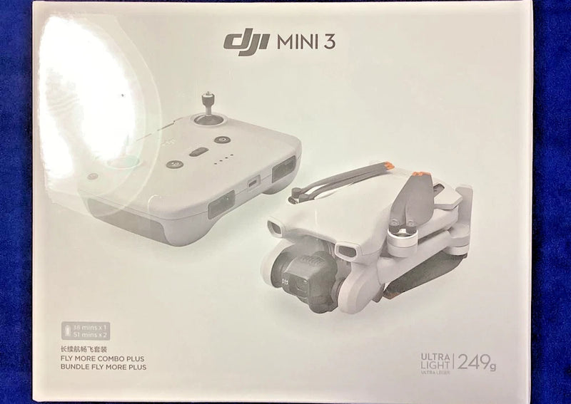 DJI Mini 3 drone with remote controller, light gray, compact foldable body