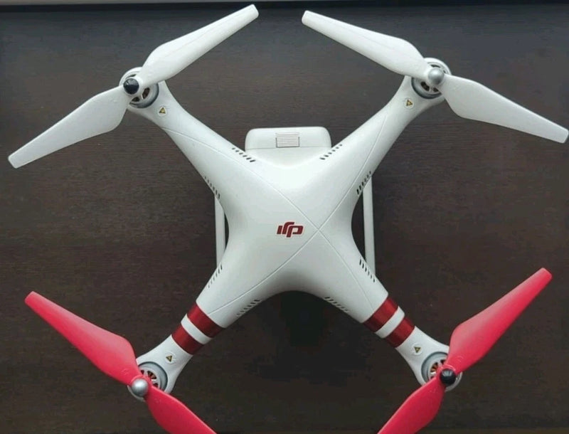 DJI Phantom 3 Standard quadcopter drone with white body and red propellers