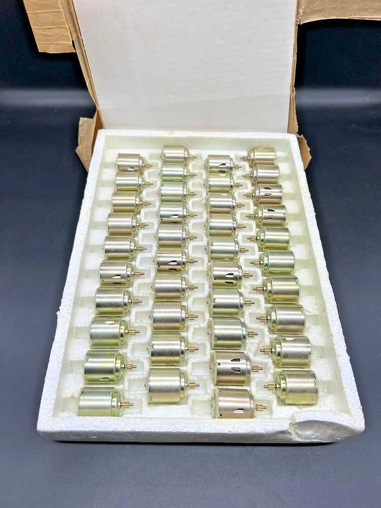 Assorted DC hobby motors in foam tray, silver metal cylinders