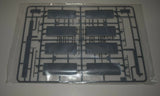 1/32 scale model aircraft parts sprue with dark gray molded components in bag