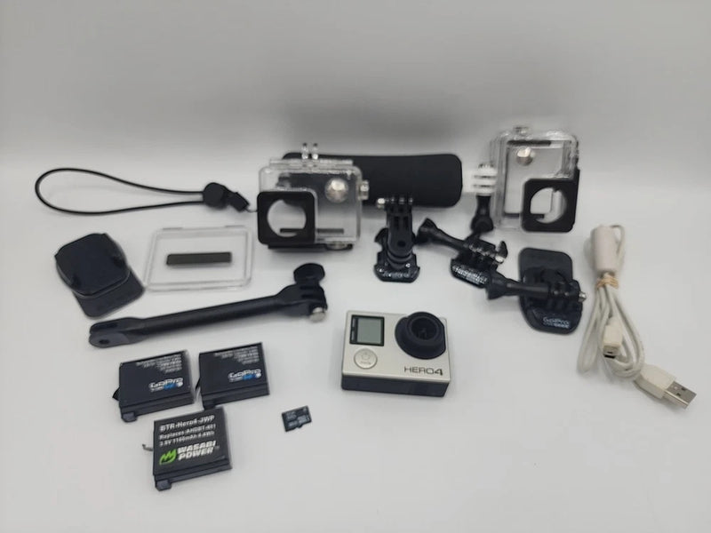 GoPro HERO4 action camera bundle with waterproof housing, mounts, SD cards, cables