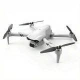 White quadcopter drone with front camera and four propellers