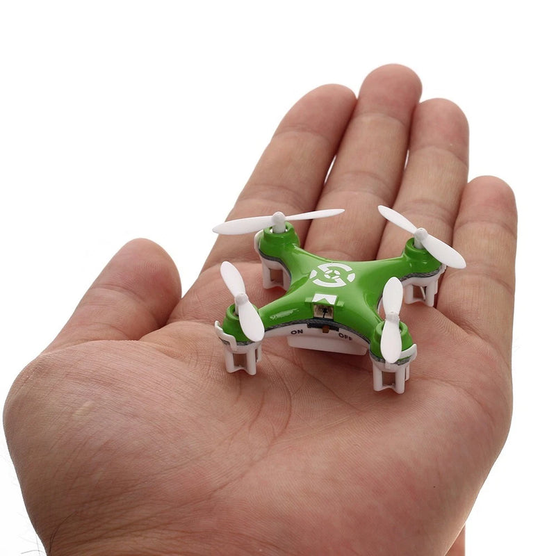 Green mini quadcopter RC drone with white propellers, compact 4-blade design