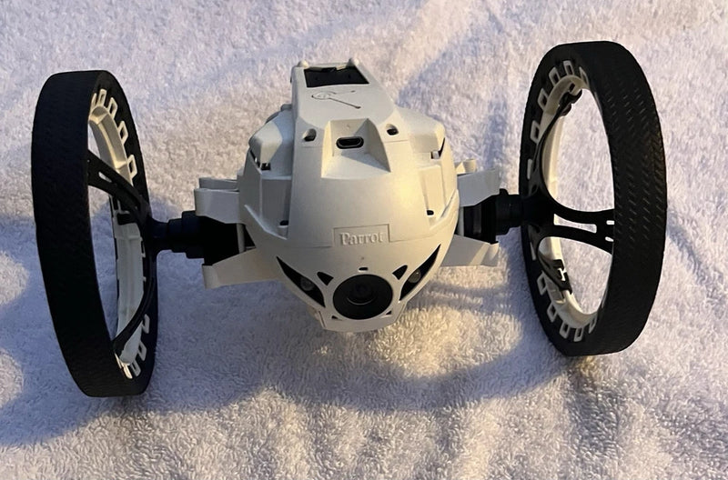 White Parrot MiniDrone jumping sumo drone with camera, two front wheels visible