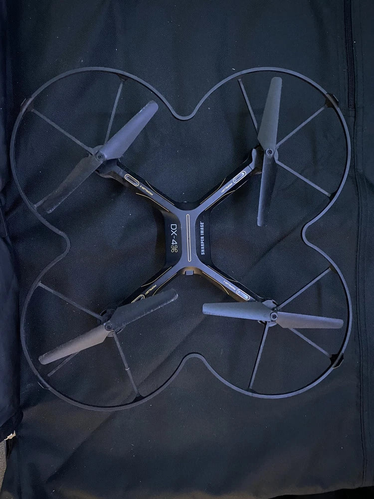 Shaper DX-4 drone with four propellers, top view, black quadcopter body