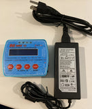 Mini battery balance charger with blue control panel and black AC/DC adapter