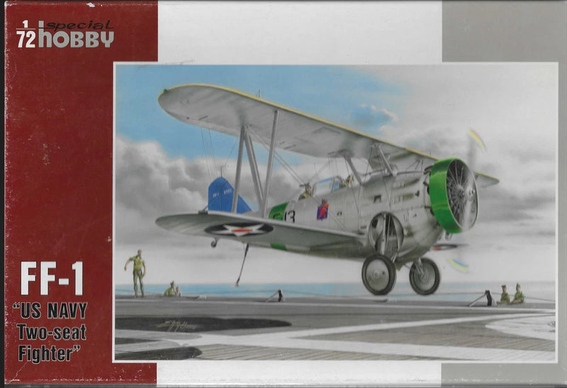 Gray two-seat fighter airplane model with green propeller, landing gear visible