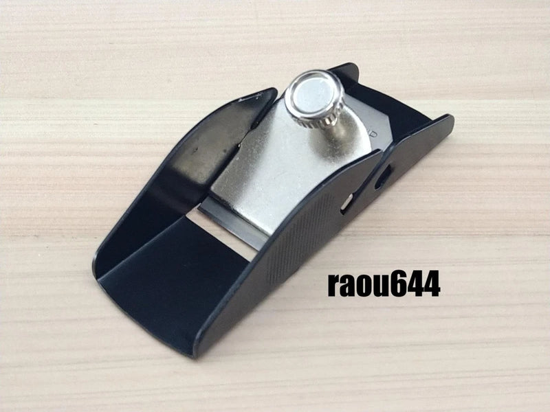 Mini carpentry plane with spare blade, black and silver metal body