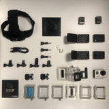 GoPro HERO3 white action camera and accessories, including LCD, mounts, batteries, and cases