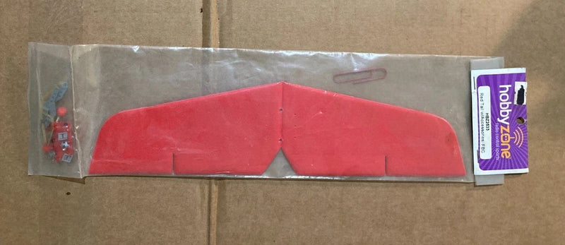 Red R/C airplane tail fin part with accessories and tag