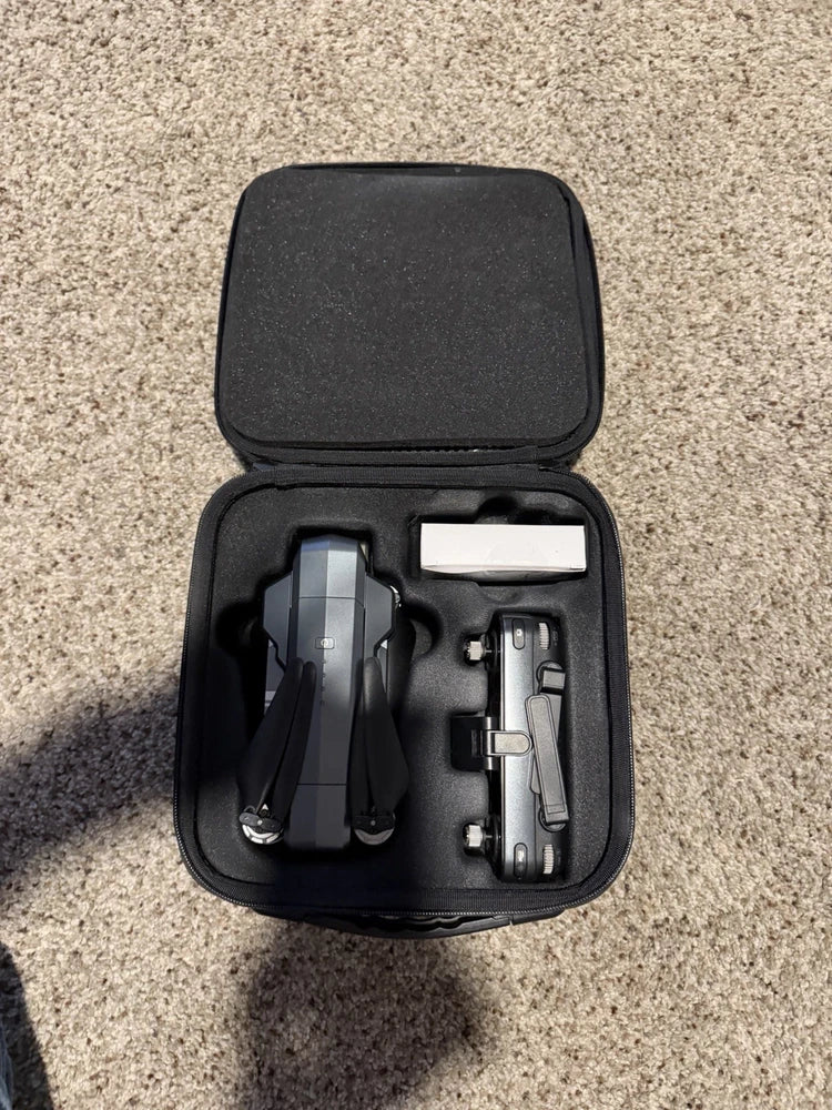 Contixo F35 drone case with folded drone, spare battery, and charger