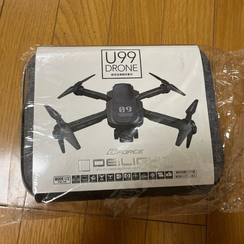 U99 quadcopter RC drone with attached camera and front propellers, in retail box